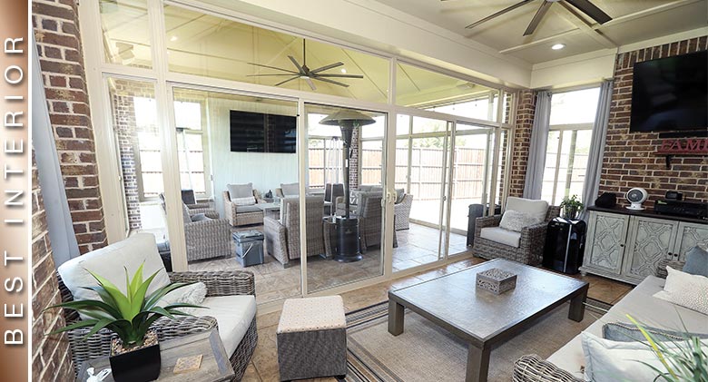 BEST INTERIOR: The interior of a tan sunroom looking into a second patio enclosure, both with comfortable furnishings & fans.