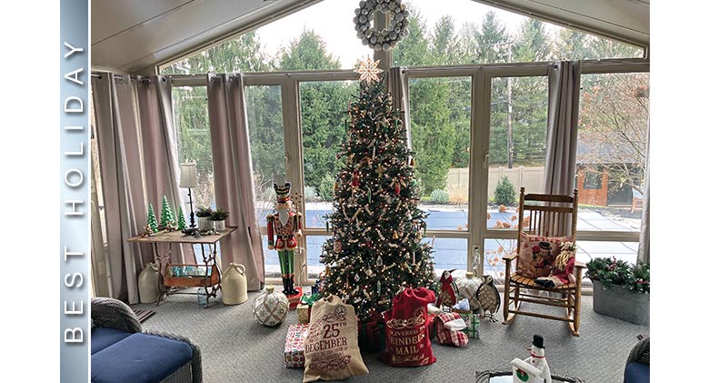 BEST HOLIDAY: A sunroom with a nicely decorated Christmas tree with star on top, packages and other décor around the tree.