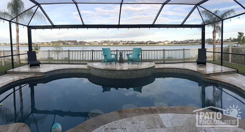 Screened pool enclosure with extreme view in bronze.