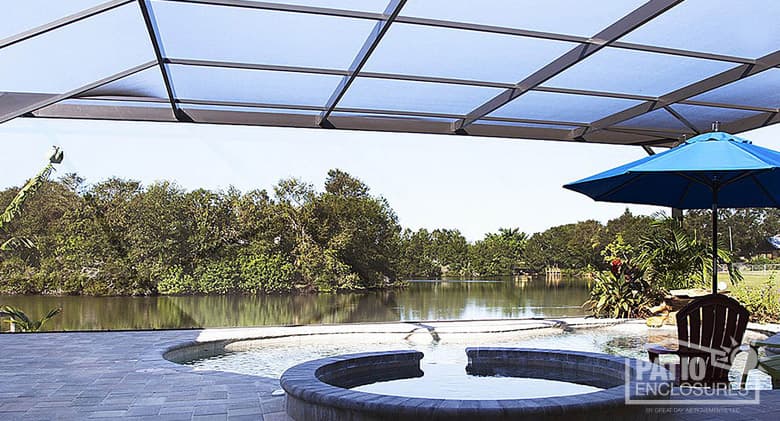 Screened pool enclosure with extreme view in bronze.