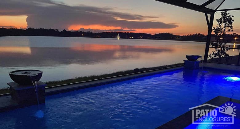 Screened pool enclosure with extreme view in bronze.